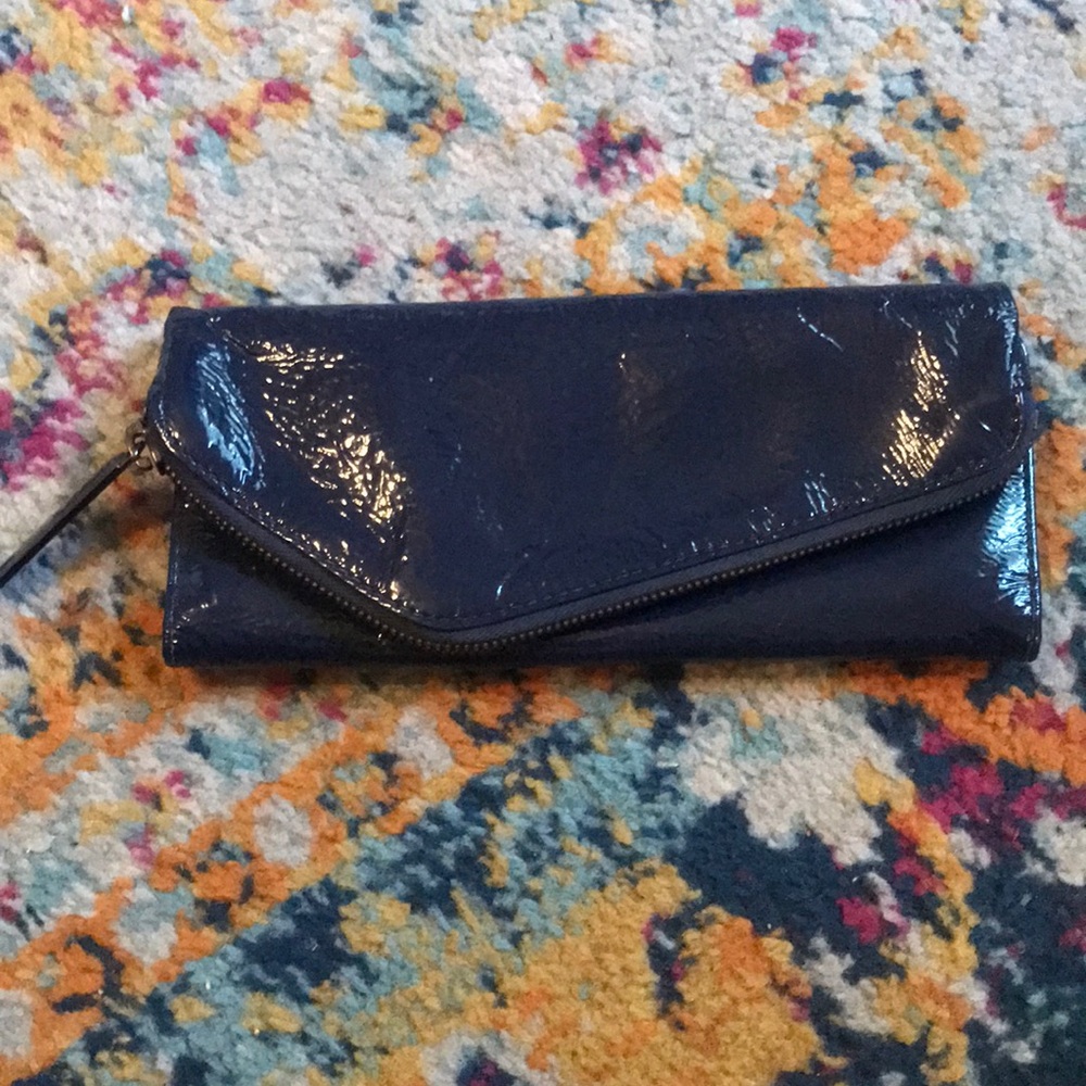 In like new condition, Hobo International Navy patten leather wallet.